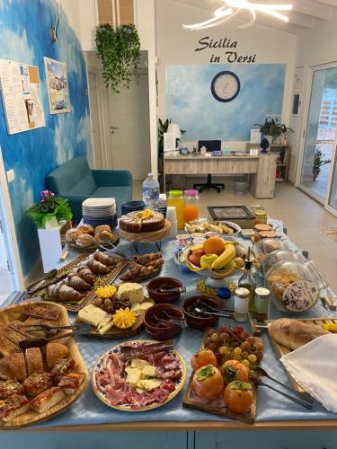 a table filled with lots of different types of food at B&B Sicilia in Versi in Custonaci