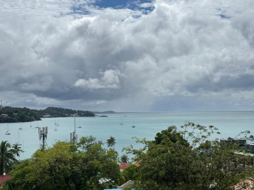 a view of a large body of water with boats at Sea Dreamer Ao Yon Beach House in Ban Ao Makham