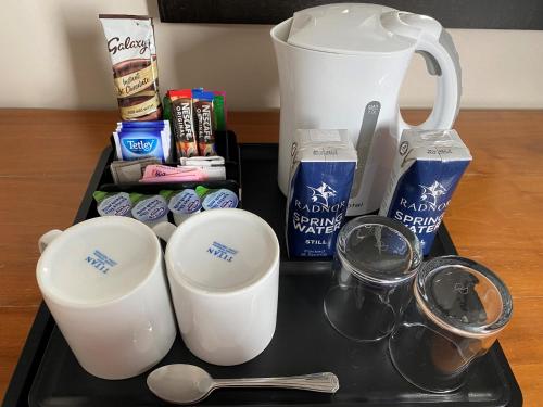 a tray with two cups and a blender and other items at Queens Hotel & Spa in Brighton & Hove