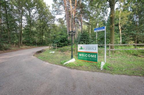 a welcome sign on the side of a road at Landgoed Leudal in Haelen