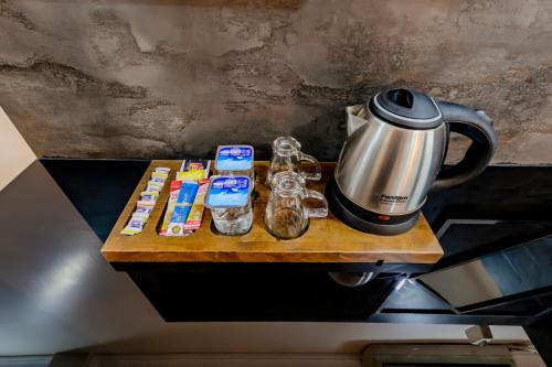 a coffee maker sitting on top of a counter with food at La Pazza Suites in Istanbul