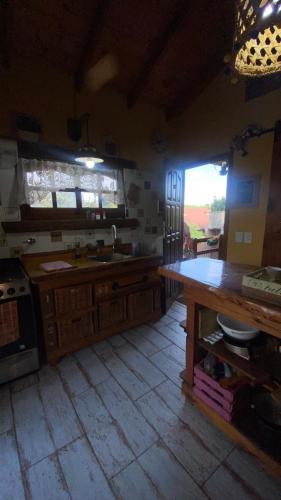 a kitchen with a sink and a counter top at Vientos de mar in Mar del Tuyú