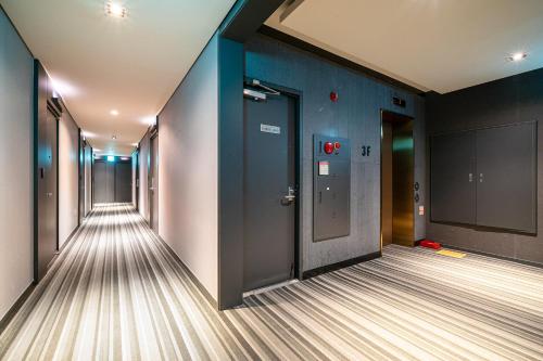 an empty corridor of an office with a bowling alley at Incheon Airport Hotel Seattle in Incheon