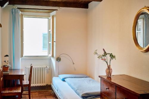Postel nebo postele na pokoji v ubytování Albergo Casa Santo Stefano