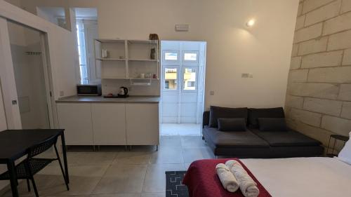 Postel nebo postele na pokoji v ubytování Casa Cospicua