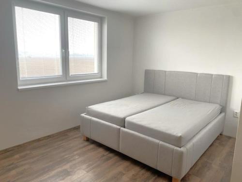 Ένα ή περισσότερα κρεβάτια σε δωμάτιο στο Bianca apartment