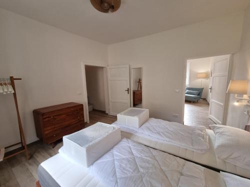 a bedroom with a large bed with two boxes on it at Panoramico 15 in Massa Marittima