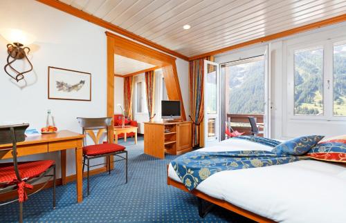 Postel nebo postele na pokoji v ubytování Derby Swiss Quality Hotel