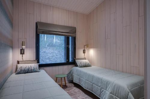 Postel nebo postele na pokoji v ubytování Villa Pulla a modern holiday home in Ruka