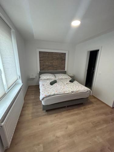 a bedroom with a bed in the middle of it at CASA BOX PREMIUM free garage in Maribor