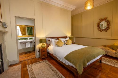 a bedroom with a bed and a fireplace at 38 St Giles in Norwich