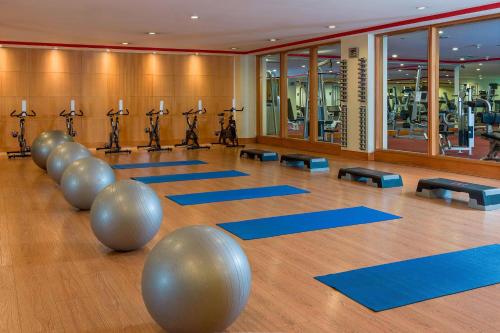 a gym with yoga mats and pilates equipment at JW Marriott Quito in Quito