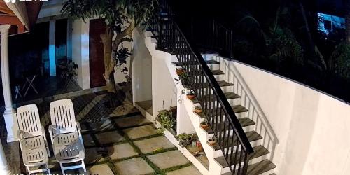 an overhead view of a stairway with two chairs at Marigold Negombo in Negombo