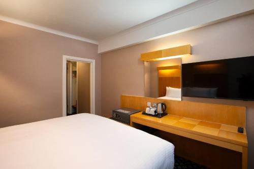 Letto o letti in una camera di Tavistock Hotel