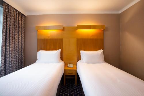 Letto o letti in una camera di Tavistock Hotel