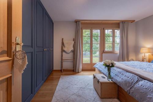 Postel nebo postele na pokoji v ubytování Wohnung Homely - Nähe Grindelwald Terminal