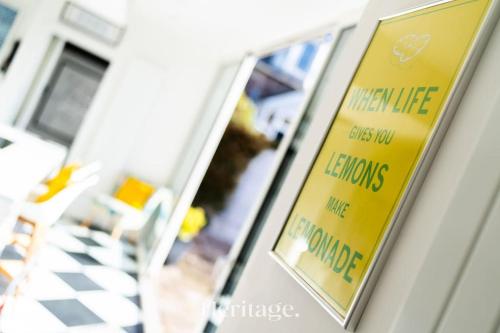 a yellow sign on the door of a building at Sunnybrae House, Family Getaway with Hot tub, Stonehaven in Stonehaven
