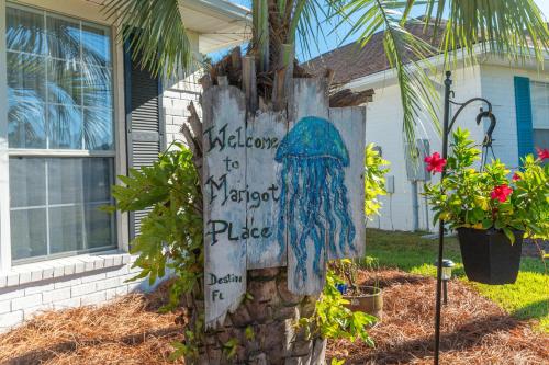 a sign that says welcome to neighborhood place in front of a house at Beautiful Pet Friendly Home! Tropical Pool, Optional Golf Cart & Pool Heat, Minutes to Beach in Destin