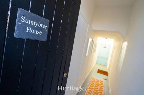 a blue door with a sign that reads summer house at Sunnybrae House, Family Getaway with Hot tub, Stonehaven in Stonehaven