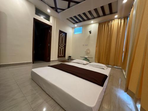 Una cama o camas en una habitación de Hotel Boss Palace