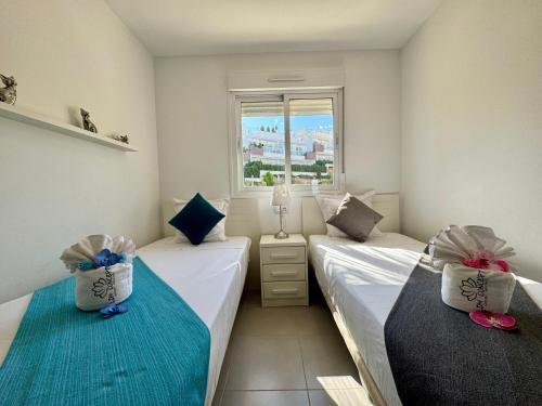 Postel nebo postele na pokoji v ubytování Nova Beach Paradise Apartment