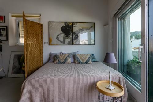Postel nebo postele na pokoji v ubytování vacances à Cadaques