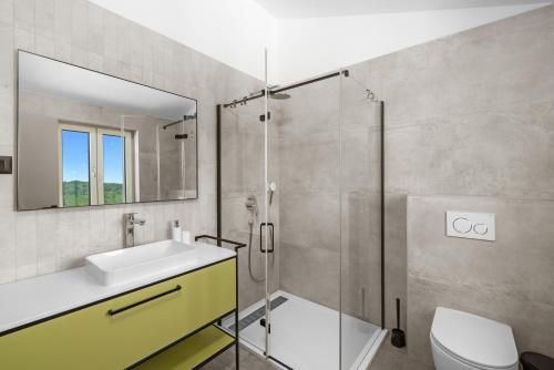 a bathroom with a sink and a shower at Villa Sentiero in Pazin