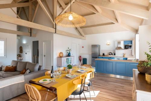 a kitchen and living room with a table and a couch at Feel Discovery Homes in Douro in Peso da Régua