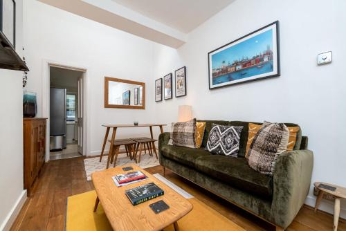 a living room with a couch and a table at GuestReady - Lovely stay in the heart of London in London