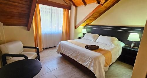 Postel nebo postele na pokoji v ubytování Hotel Tungurahua