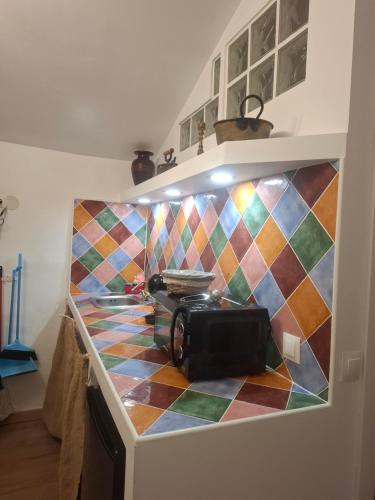 a kitchen with a counter with a camera on it at La madrileña 2 in Casabermeja