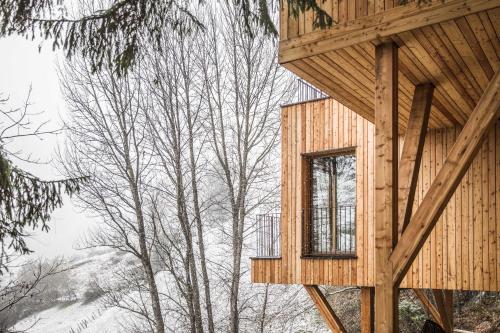 a wooden house with a window on the side of it at Hotel Bad Fallenbach in San Leonardo in Passiria