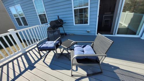 two chairs and a table on a porch at Cozy SFH for Active Adults in Middletown