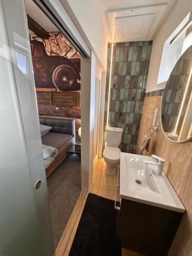 a bathroom with a sink and a toilet at Ateliér Kráľovič in Hokovce