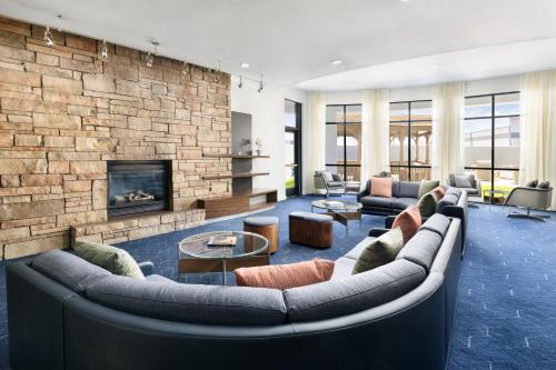 a living room with couches and a fireplace at Courtyard by Marriott Amarillo West/Medical Center in Amarillo