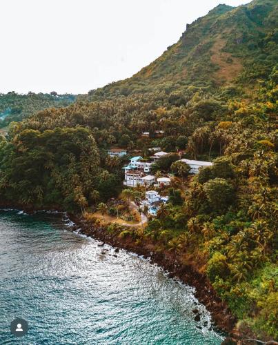 an aerial view of a resort on a hill next to the water at Bintana Sa Paraiso in Mambajao
