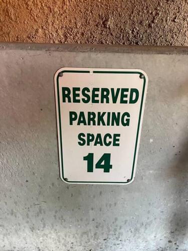 a reserved parking space sign on a wall at Manitou Incline Retreat in Manitou Springs