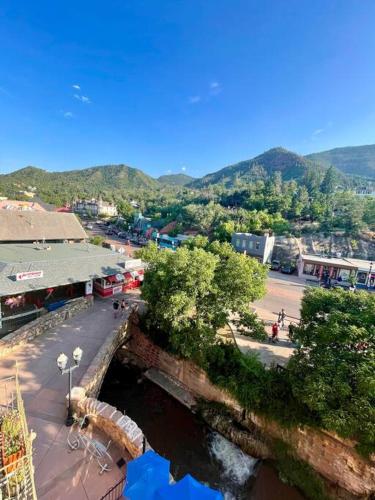 a view of a town with a river and a street at Manitou Incline Retreat in Manitou Springs