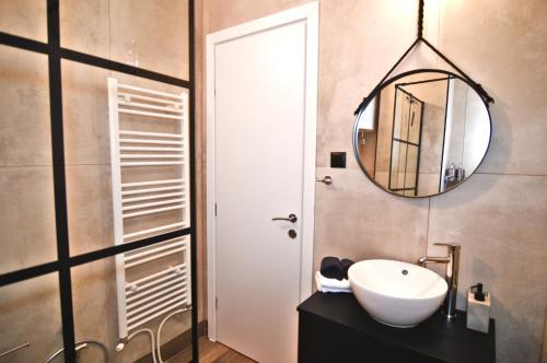 a bathroom with a sink and a mirror at Fanis And Olgas Cozy Stay in Kastoria