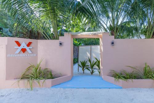 a entrance to a resort on the beach at Aashaan View Thoddoo in Thoddoo