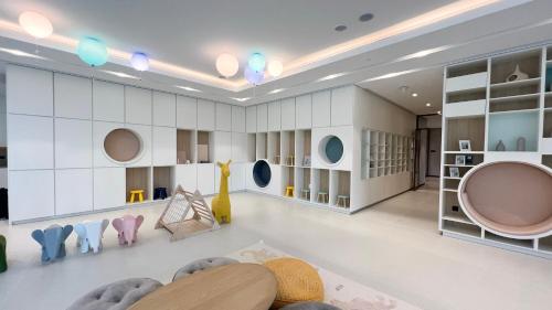 a room with white walls and a room with furniture at Best View In Dubai With FULL Burj Khalifa, Fountains, Park View, Next to Dubai Mall and Opera in Dubai