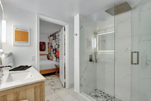 a bathroom with a shower and a sink at Fall in love with Brickell - Your Miami home in Miami
