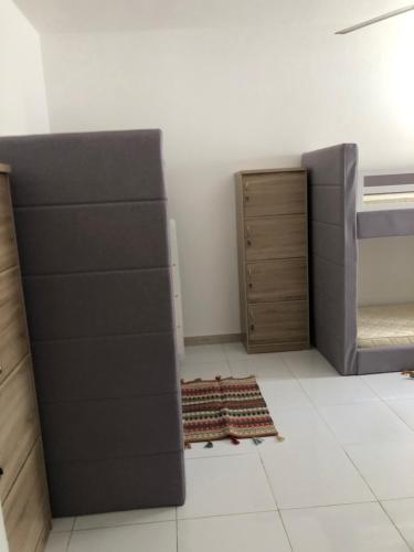 Una cama o camas en una habitación de Legacy Hostel
