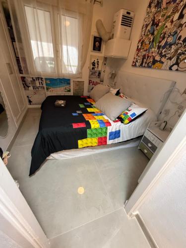 a small bedroom with a bed in a room at FLAT Surrounded by Nature WIFI & Pool & beach Nearby in Son Parc