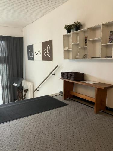 a living room with a table and a desk at Mosel - River - Quartier 31 in Lieser