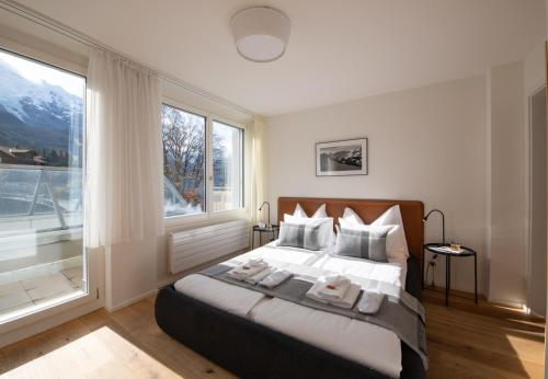 En eller flere senger på et rom på Apartment Jungfrauview