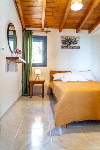 a bedroom with a bed and a window at Nenes House in Koroni