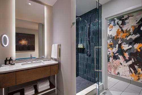 a bathroom with a sink and a shower at W Austin in Austin