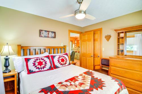 a bedroom with a bed and a dresser at 4 Mi to Cumberland River Cabin with Deck and Fire Pit in Burnside