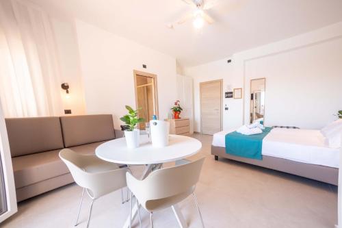 Postel nebo postele na pokoji v ubytování Residence Villa Giardini
